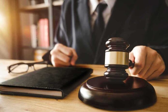 1035925210 featured image A judge with a hammer and a book