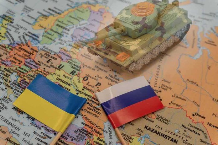 2114384846 featured image Ukrainian and Russian flags on a map