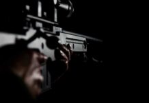 An assassin holding a gun