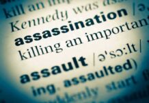 Assassination written on paper