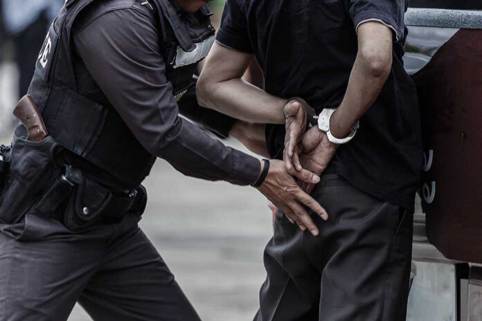 665013085 featured image Man arrested and handcuffed