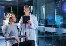 Woman undergoing brain scan with doctor monitoring results