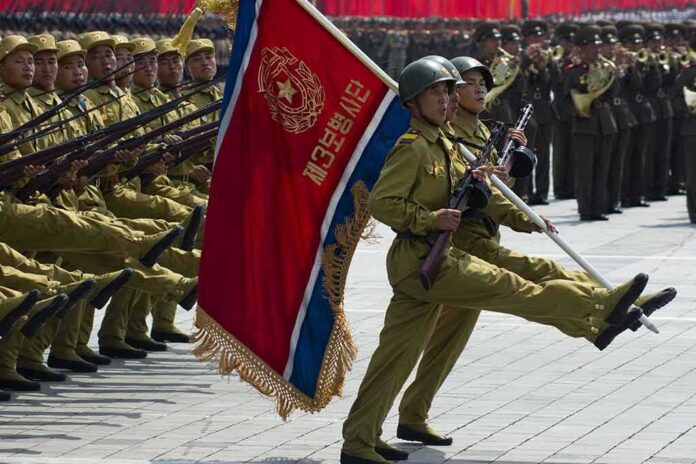 148621262 featured image Soldiers marching with rifles and a red flag