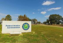 Federal Aviation Administration sign on grassy lawn