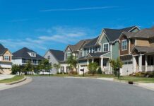 Suburban street with colorful modern houses