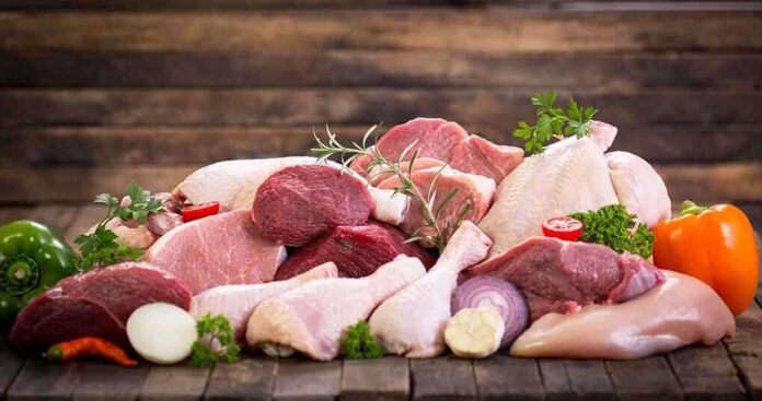 497502007 featured image Assorted raw meat with vegetables on wooden table
