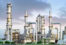 Industrial plant with metal towers and pipes