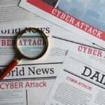 Massive Data Leak HITS Healthcare—5 Million at Risk Newspapers with Cyber Attack headlines and a magnifying glass