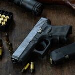Catholic Holiday TURNS DEADLY — Horror in Irapuato Handgun with ammunition magazine and rifle on wooden table