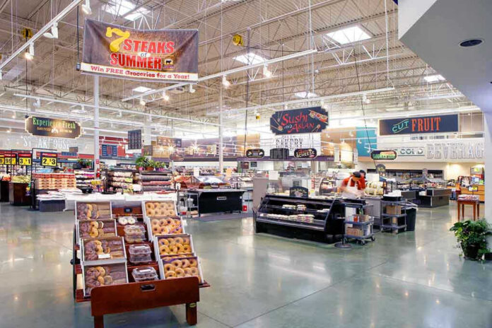 Supermarket interior with various food sections and displays.