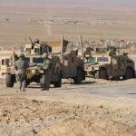 Federal Force SCRAMBLE—Firestorms Break Control Soldiers beside military vehicles in a desert area
