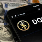 Massive Waste Cut – 123 Federal Contracts Axed Smartphone displaying Doge logo on hundred dollar bills