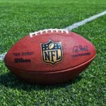 Senator BLASTS NFL Over This Hiring Decision An NFL football resting on a green grass field