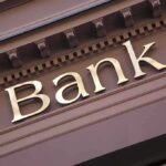 Banks Monitoring for Chinese Money Laundering Close-up of a bank sign with gold lettering