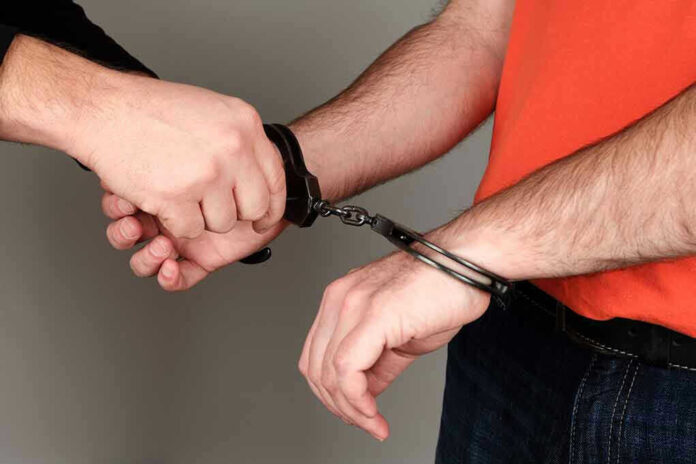 Person handcuffing another persons wrists