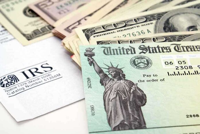 A tax refund check from the IRS alongside various denominations of cash