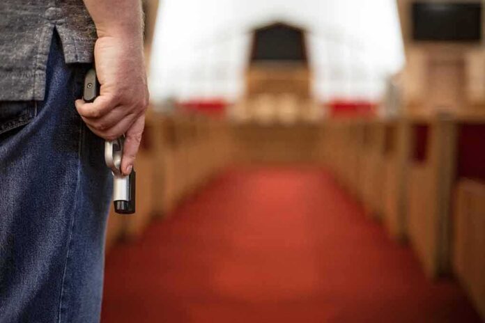 Person holding a gun in a church setting