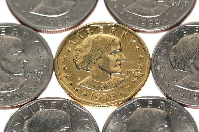 shutterstock_3478782.jpg A collection of coins featuring a gold coin surrounded by silver coins