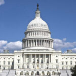 Drinking Milk Declared RACIST – According to Woke Dem Rep U.S. Capitol building against blue sky.