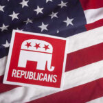Drive-By Gunfire Hits Republican Candidate’s Home! Republican symbol on American flag background.