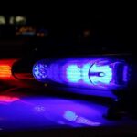 Father STABS Infant – Claims It Was a SACRIFICE! Close-up of police lights flashing in blue and red at night