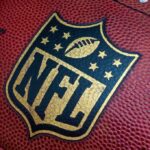 Warplanes PULLED From Super Bowl Flyover – War Speculation Grows Close-up of an NFL football with the logo prominently displayed