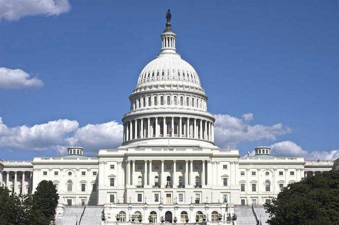 119536138 U.S. Capitol building against blue sky.