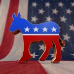 Dems Newest Star So Woke Even Far-Left Are Afraid A donkey symbol representing the Democratic Party in front of an American flag background