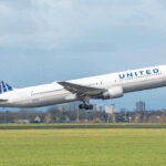 United airplane taking off from a runway.