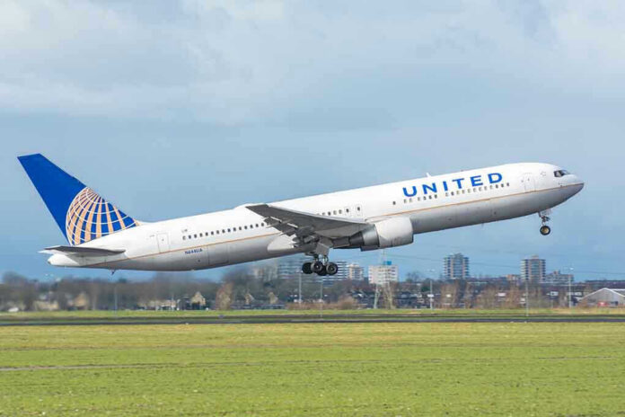 United airplane taking off from a runway.
