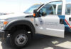 U.S. Customs and Border Protection truck with open door.