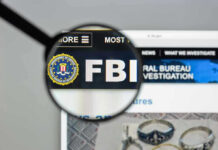 FBI Raids Senators Office After THIS Happened FBI website shown through magnifying glass.