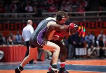 Wrestler Sexually Assaulted by Man Competing As a Woman! Two wrestlers competing on a mat during a match