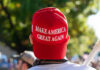 Boardwalk Brawl ERUPTS Over Trump Merch! Person wearing a red Make America Great Again hat.