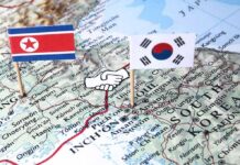 Map of Korean Peninsula with North and South Korean flags and handshake icon
