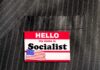Name tag on a pinstripe suit jacket pocket