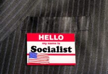 Name tag on a pinstripe suit jacket pocket