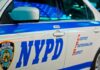 NYPD DEFY Mamdani’s Order – They’re Standing Down NYPD patrol car side with blue stripe and door lettering