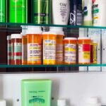 AIDS-Era Ban Faces Shocking Comeback Battle Medicine cabinet with prescription bottles and toiletries