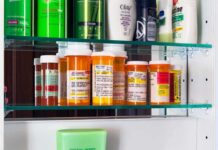 AIDS-Era Ban Faces Shocking Comeback Battle Medicine cabinet with prescription bottles and toiletries