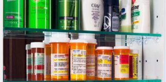 Medicine cabinet with prescription bottles and toiletries