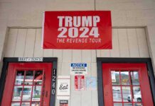 Trump Store BANKRUPT – Closes Down Immediately red political banner above two red doors on a storefront
