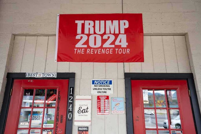 shutterstock_2229960541 red political banner above two red doors on a storefront