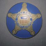United States Secret Service badge emblem on blue background