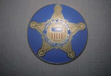 United States Secret Service badge emblem on blue background