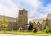 Gothic-style university building with central stone tower