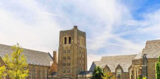 Gothic-style university building with central stone tower