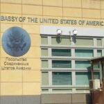United States Embassy exterior with signage and seal