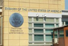 United States Embassy exterior with signage and seal