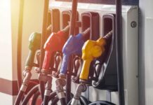Fuel pump nozzles in multiple colors at a gas station